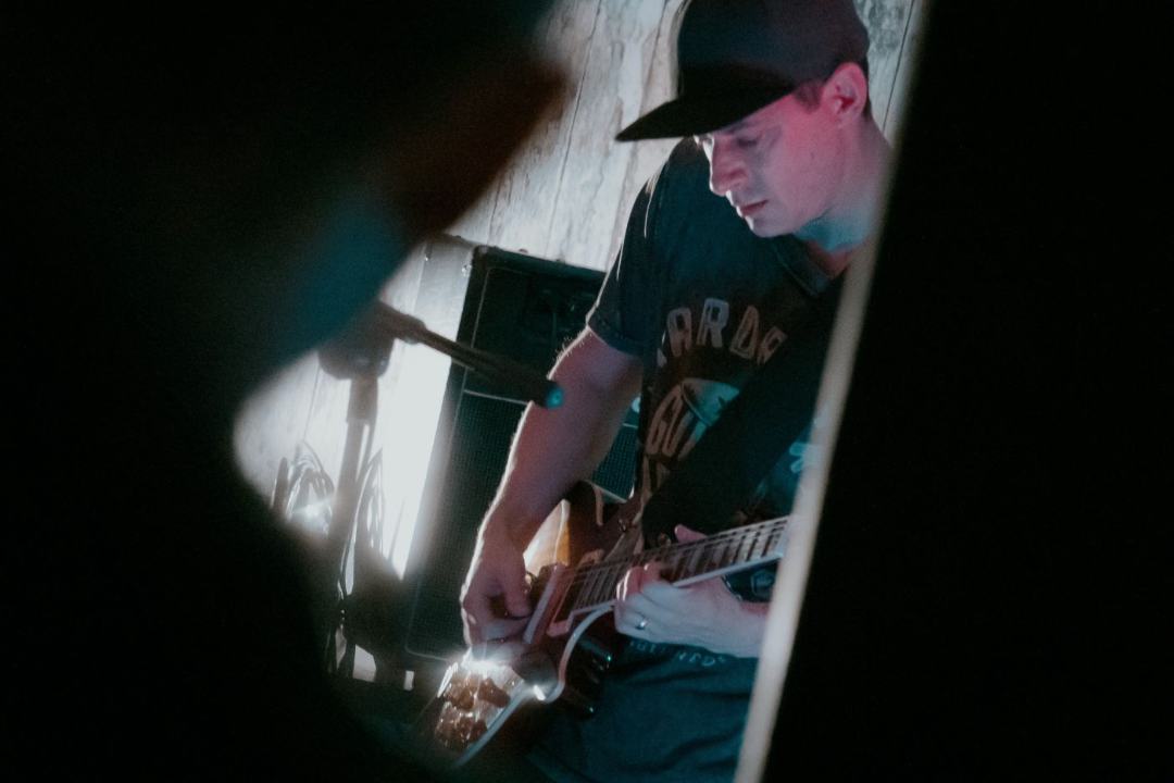 Guitarist mid-song, close up
